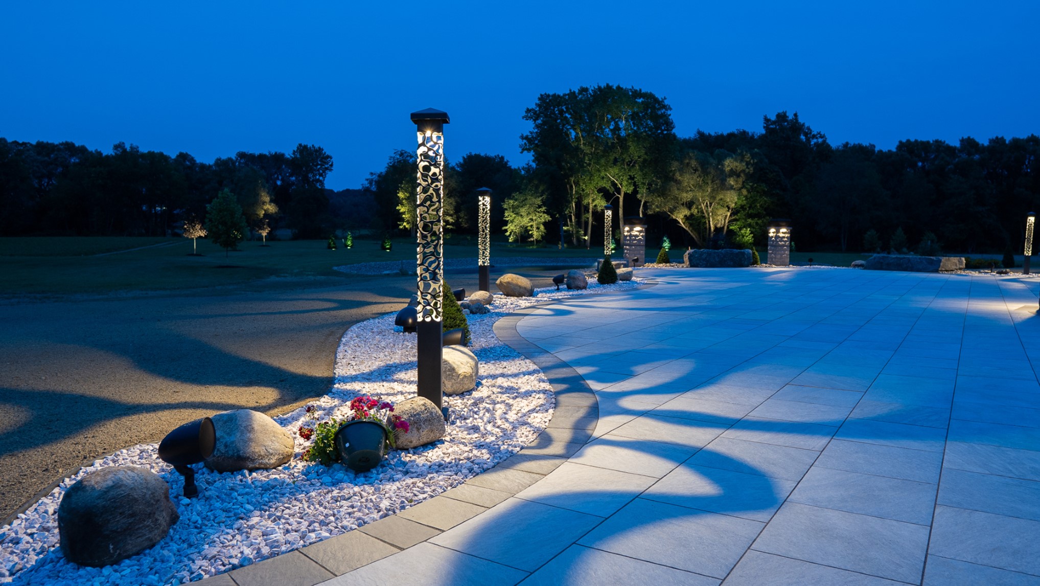 large sculpted concrete driveway at night